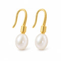 Adriana pearl earrings, 7-8mm white rice pearls beneath ribbed shepherd's hooks and caps