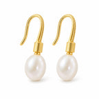 Adriana pearl earrings, 7-8mm white rice pearls beneath ribbed shepherd's hooks and caps