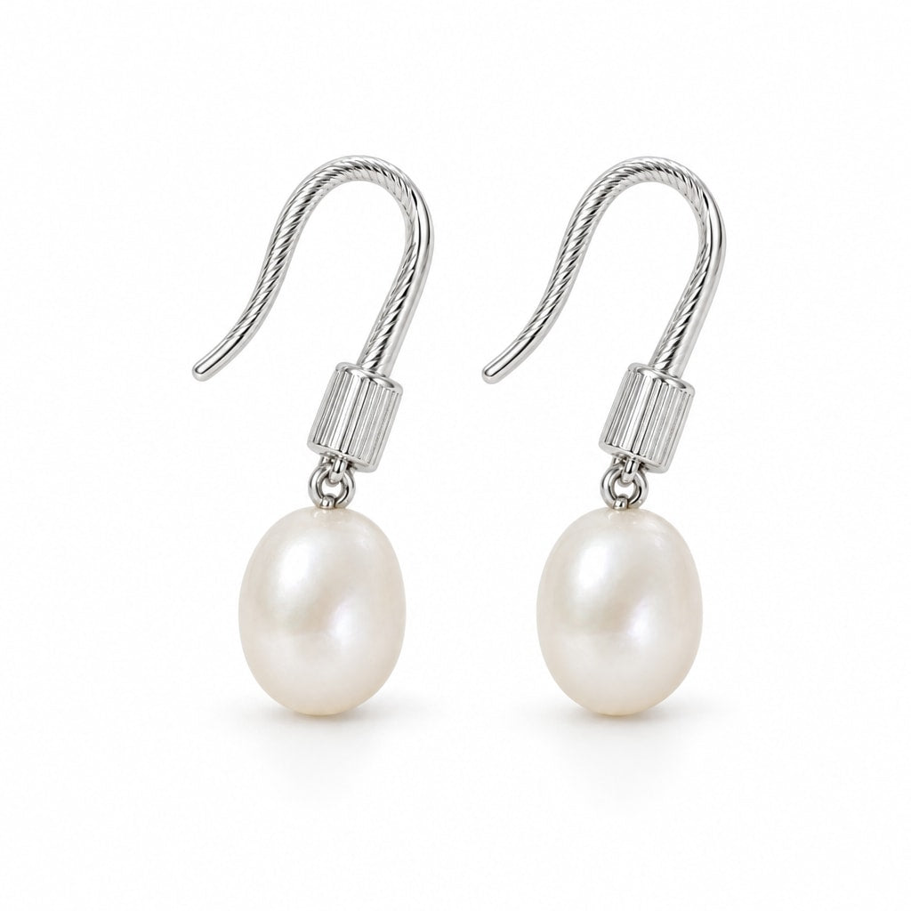 Adriana pearl earrings, 7-8mm white rice pearls beneath ribbed shepherd's hooks and caps - second finish