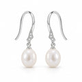 Alba pearl earrings, 7-8mm white rice pearls hanging from shepherd's hooks with small textured accents - second finish