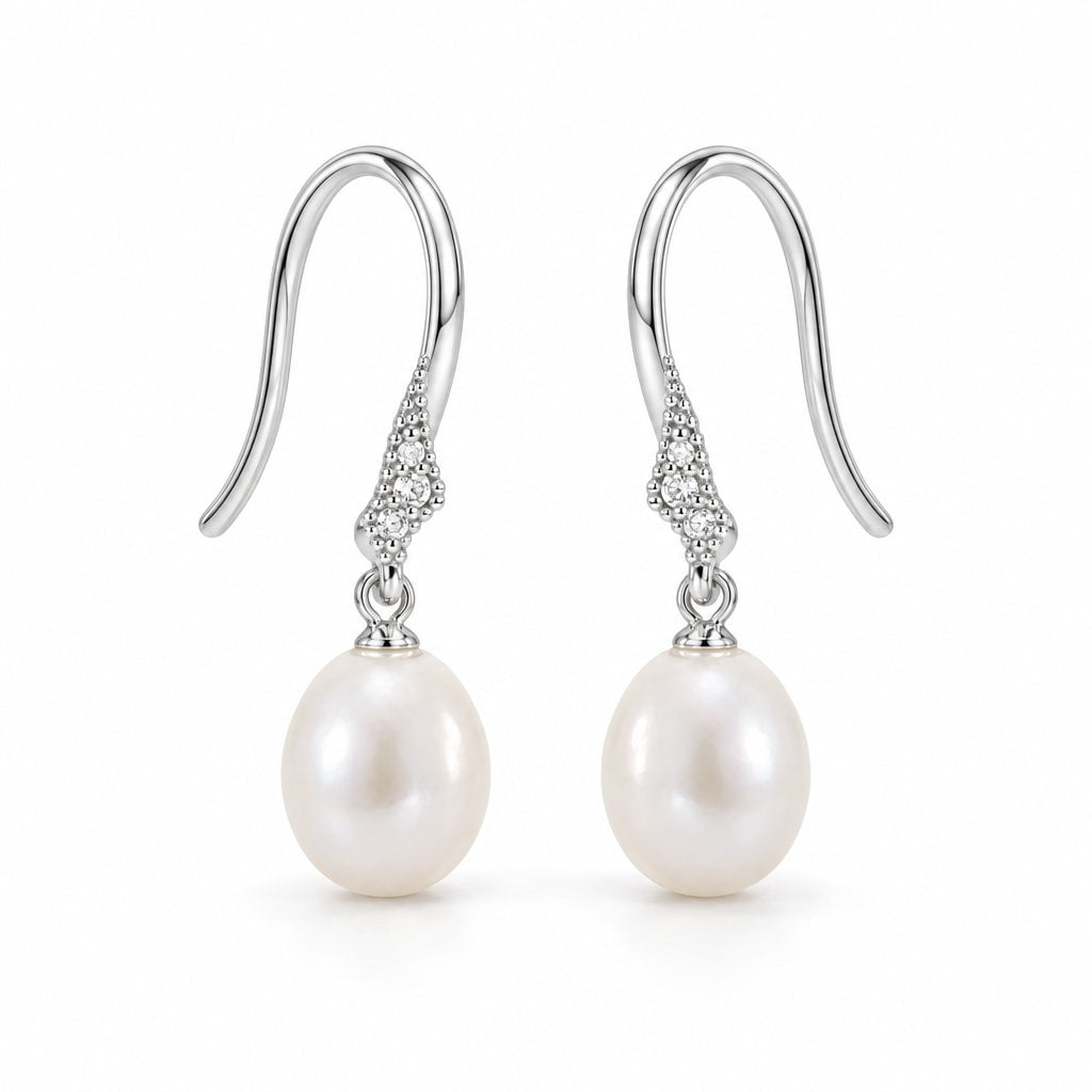 Alba pearl earrings, 7-8mm white rice pearls hanging from shepherd's hooks with small textured accents - second finish