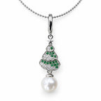 Alma Christmas tree pendant necklace with green and clear crystals and a white pearl in gold-plated silver on white