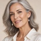Woman in her thirties wearing the Anouk calla lily pearl drop earrings, hair down