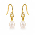 Antonia pearl earrings, 7-8mm white rice pearls hanging from small pavé rings on shepherd's hooks