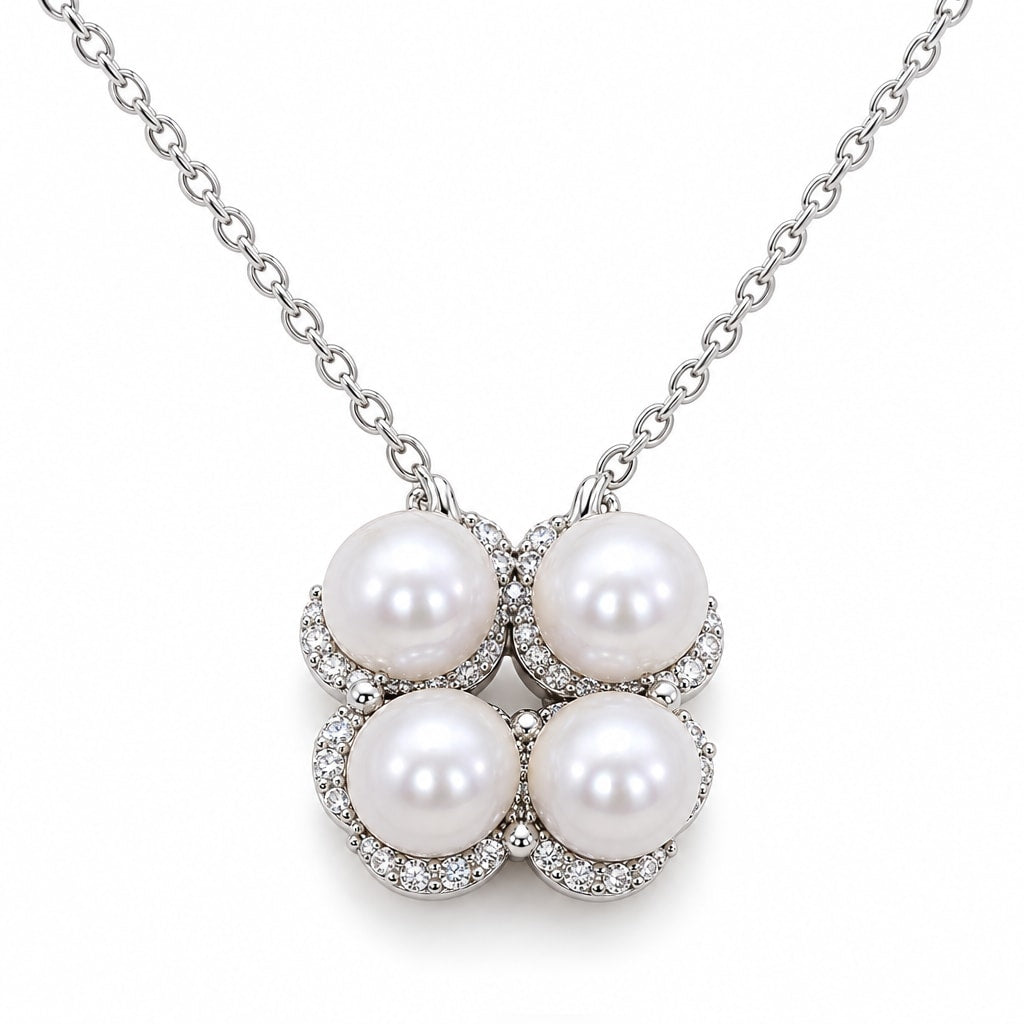 Birgitta four freshwater pearl pendant necklace with crystal pavé crescents in sterling silver on white background