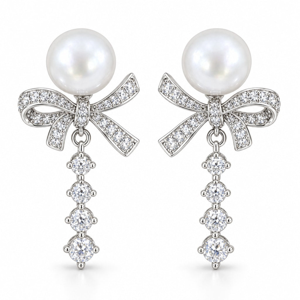 Blanche pavé bow pearl drop earrings, 10-11mm white freshwater pearls above crystal bows and graduated crystal tails