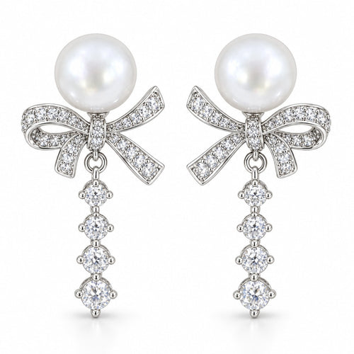 Blanche pavé bow pearl drop earrings, 10-11mm white freshwater pearls above crystal bows and graduated crystal tails