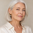 Woman in her forties wearing the Brigitte bamboo pearl hoop earrings, hair pulled back
