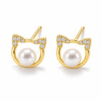 Camilla pearl earrings, cat-face outlines with pavé ears and white button pearls at the center