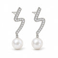 Celine pearl earrings, 7-8mm white button pearls hanging from pavé zigzag bars - second finish