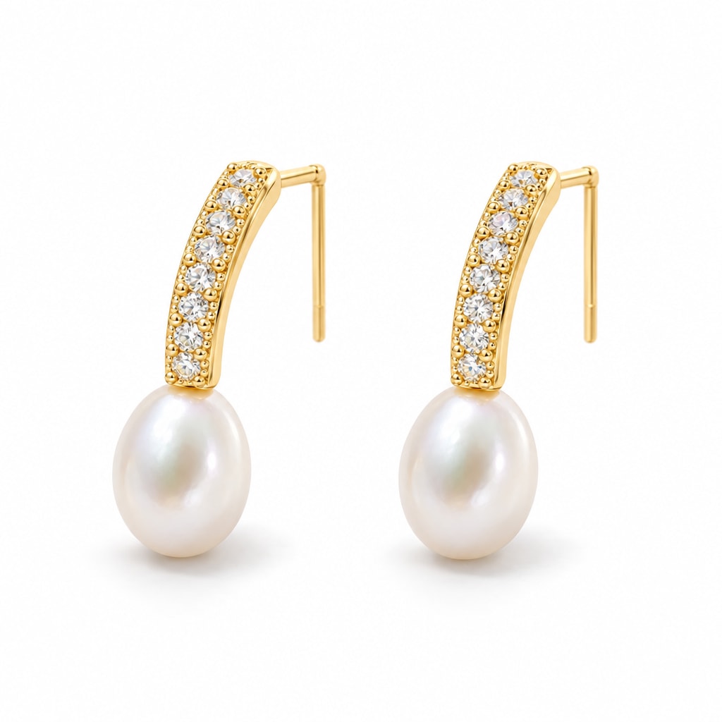 Clemence pearl earrings, 7-8mm white rice pearls fixed beneath curved pavé bars