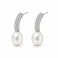 Clemence pearl earrings, 7-8mm white rice pearls fixed beneath curved pavé bars - second finish