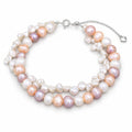 Cosima double-strand bracelet with multicolor potato pearls and white keshi pearls, flat lay on light blue