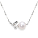 Dagny leaf sprig freshwater pearl station necklace in polished sterling silver on white background