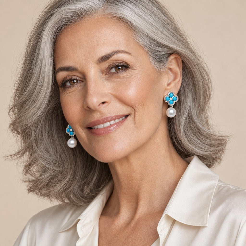 Woman in her forties wearing the Elise turquoise clover pearl drop earrings, hair pinned up