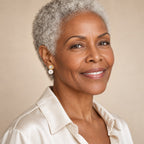 Woman in her fifties wearing the Fabienne halo pearl earrings, hair swept up