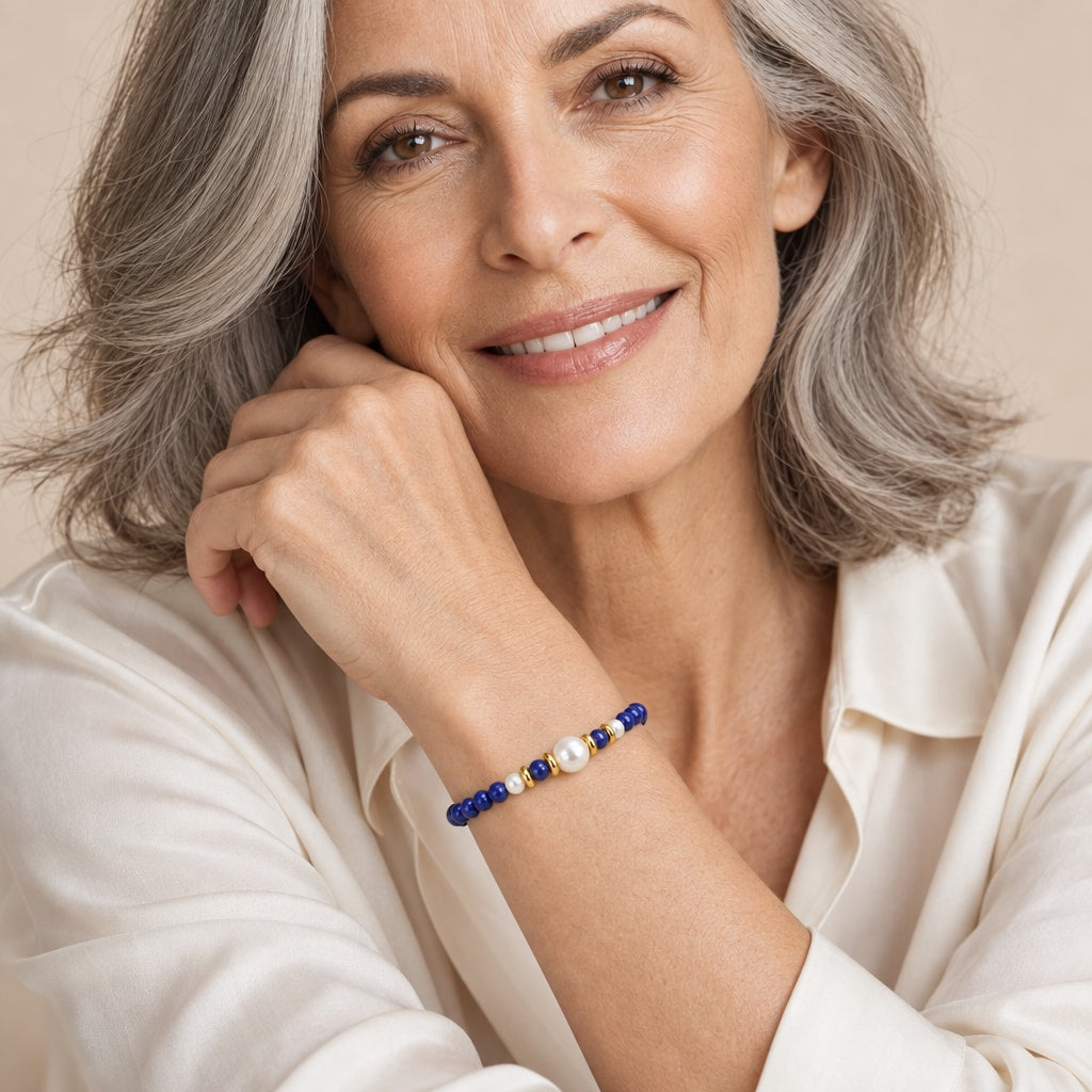 Close-up of a wrist wearing the Giulia dark blue bead and pearl bracelet