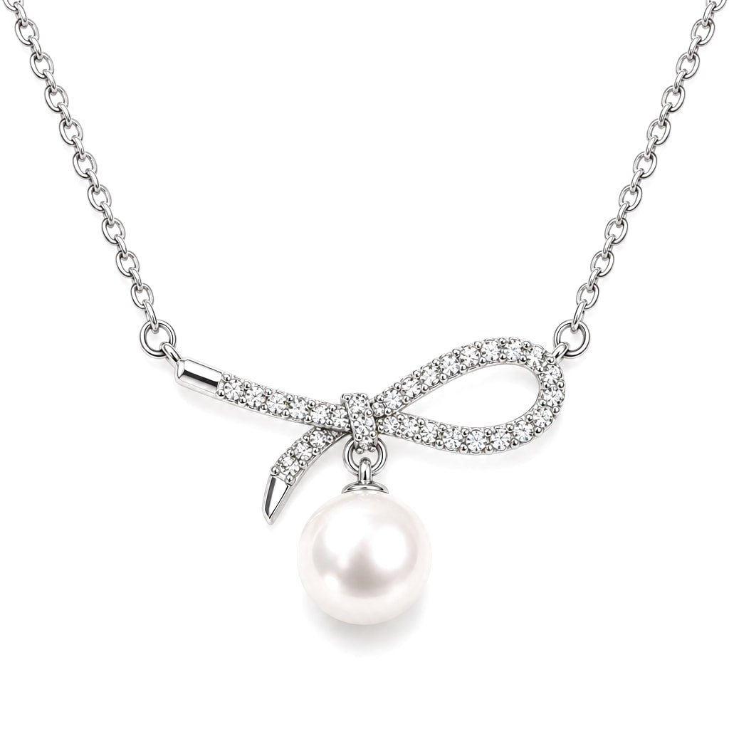 Grace pavé bow freshwater pearl pendant necklace in sterling silver on white background