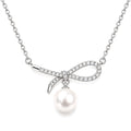 Grace pavé bow freshwater pearl pendant necklace in sterling silver on white background