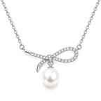 Grace pavé bow freshwater pearl pendant necklace in sterling silver on white background