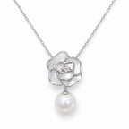 Hedda sculpted rose and freshwater pearl drop pendant necklace in sterling silver on white background