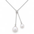 Ingrid double freshwater pearl lariat necklace with a polished slider bead in sterling silver on white background