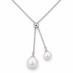 Ingrid double freshwater pearl lariat necklace with a polished slider bead in sterling silver on white background