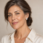 Woman in her forties wearing the Katharina pavé cross pearl studs, hair pulled back
