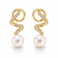 Laurence pearl earrings, pavé ribbons coiling down to 7-8mm white button pearls