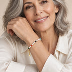 Close-up of a wrist wearing the Ludovica pearl and multicolor bead bracelet