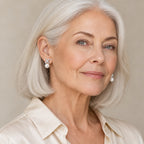 Woman in her fifties wearing the Luise pavé X pearl stud earrings, hair up