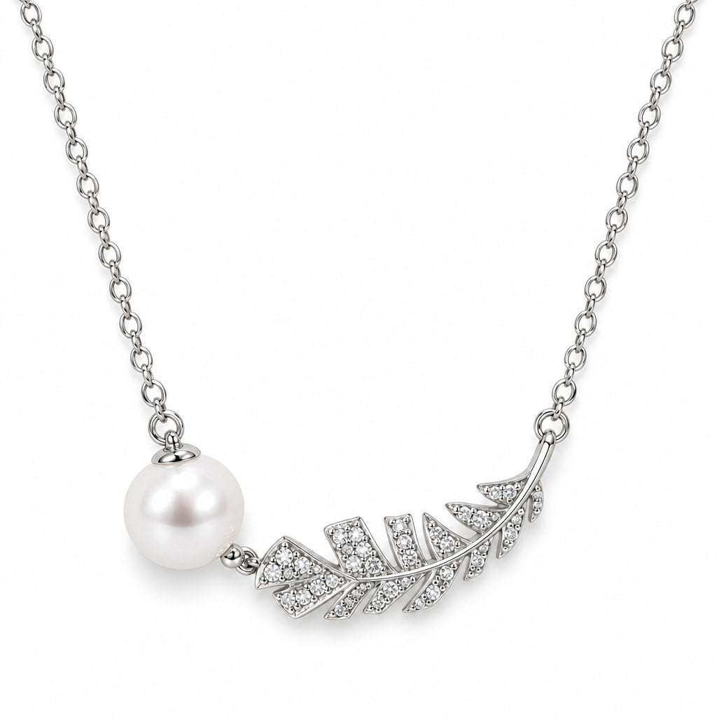 Lydia pavé feather pearl necklace with a round white freshwater pearl in sterling silver on white background