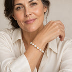 Close-up of a wrist wearing the Maddalena rice pearl and bead bracelet