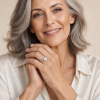 Close-up of a model's hand wearing the Nancy open pearl ring in sterling silver