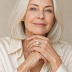 Close-up of a model's hand wearing the Rachel pavé leaf pearl ring in sterling silver