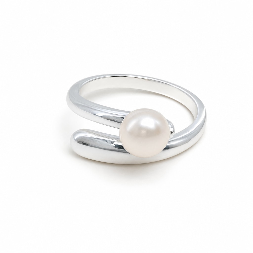 Rhiannon polished bypass pearl ring in sterling silver on white background