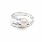 Rhiannon polished bypass pearl ring in sterling silver on white background