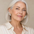 Woman in her fifties wearing the Saskia baroque pearl butterfly earrings, hair tucked behind her ear