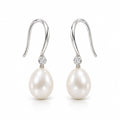 Sidonie pearl earrings, 7-8mm white rice pearls beneath single bezel-set crystals on hooks - second finish