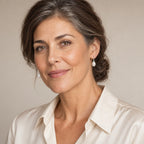 Woman in her forties wearing the Solveig pearl hook drop earrings, hair tucked behind her ear