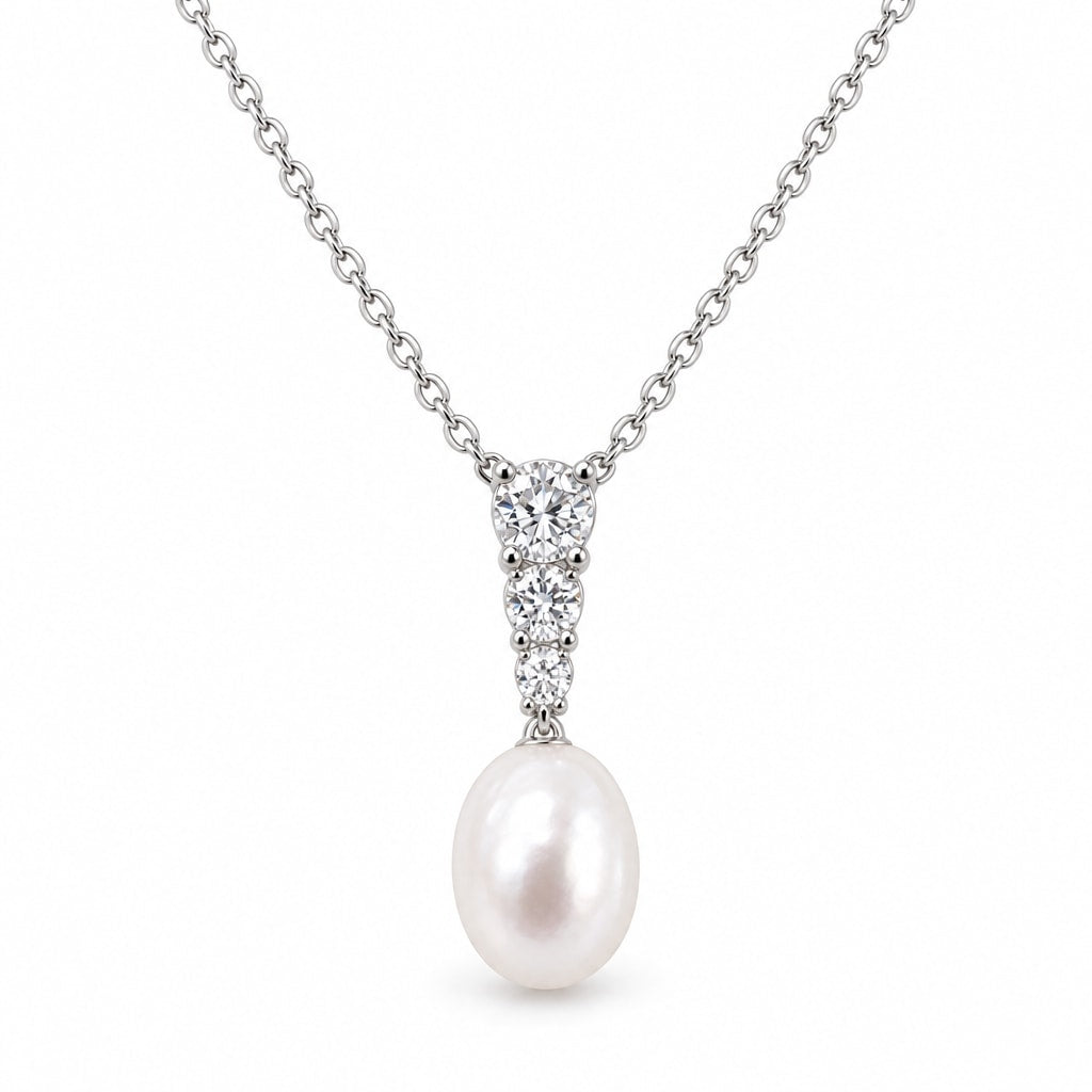 Stella three-stone rice pearl pendant necklace in sterling silver on white background