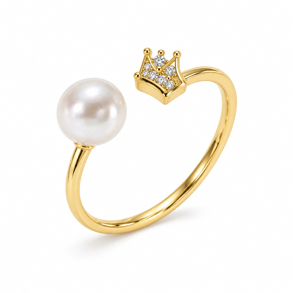 Una crown and pearl open ring in gold-plated sterling silver on white background